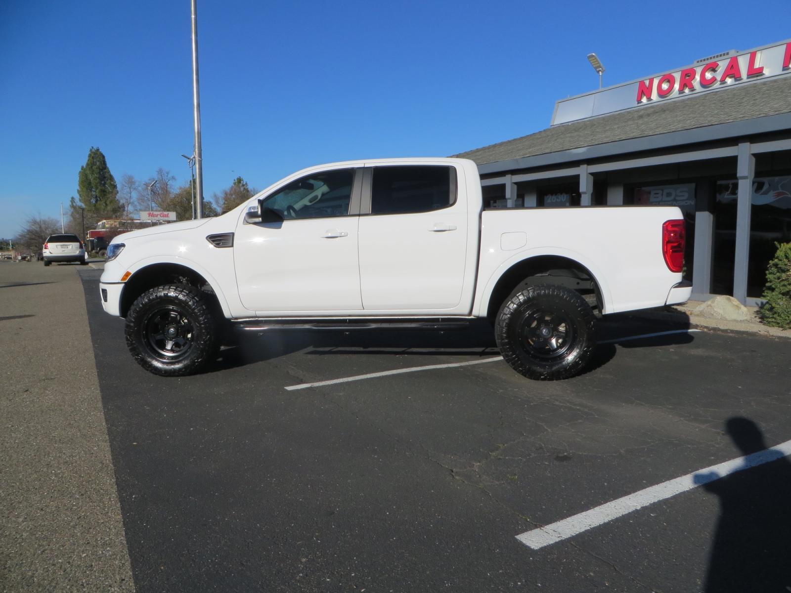 2019 White /Black Ford Ranger Lariat (1FTER4FHXKL) with an 2.3L engine, automatic transmission, located at 2630 Grass Valley Highway, Auburn, CA, 95603, (530) 508-5100, 38.937893, -121.095482 - Features a Fabtech suspension system, Fuel Offroad wheels, Nitto Ridge Grappler tires, Westin Running boards, and a Bakflip. - Photo #6